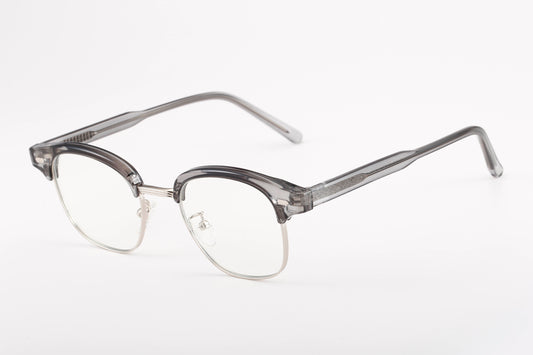 Timeless harmaat sinivalolasit sivulta – minimalistinen ja kevyt rakenne, joka tekee laseista miellyttävät pitkäaikaiseen käyttöön.